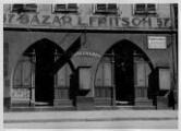 1 vue  - Rue des Grandes Arcades n°57, \'Bazar L. Fritsch\'. [1940-1944]. (ouvre la visionneuse)