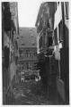 2 vues  - Rue du Vieil-Hôpital vers la Grande Boucherie, après le bombardement aérien du 11 août 1944 (2 vues). (ouvre la visionneuse)