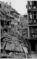 1 vue  - Place du Marché-aux-Cochons-de-Lait, dégâts sur les immeubles dus au bombardement aérien du 11 août 1944. (ouvre la visionneuse)